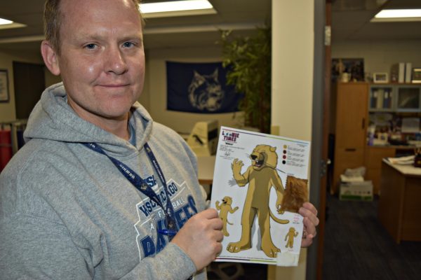 Student activities director Marc Wolfe was provided with fur samples to choose the new costume. 