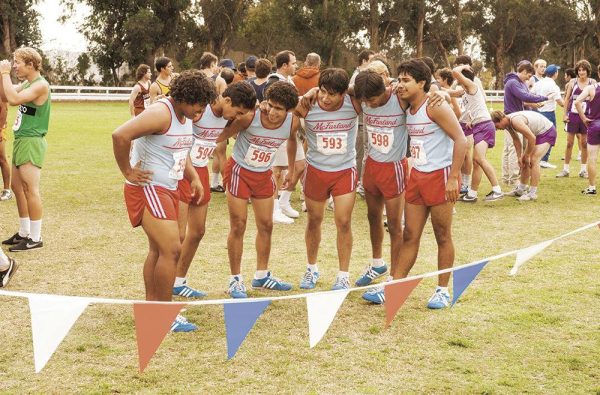 Huddled together, the winning McFarland High sSchool cross country team celebrates their victory (Photo courtesy of Disney).