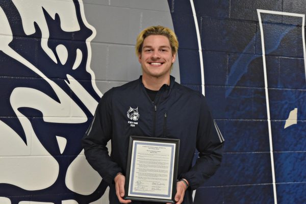 Brady Johnson received a Certificate of Recognition for his outstanding swimming legacy at WCCHS.