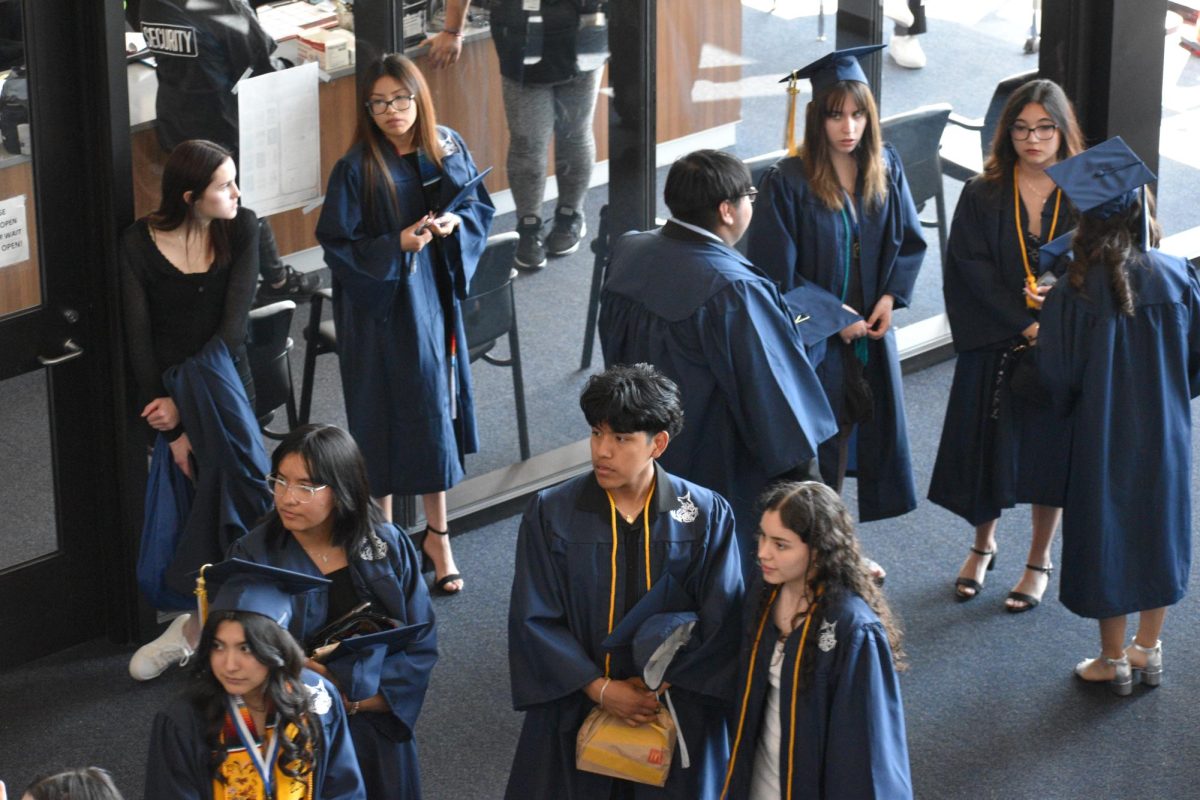 Graduates line up at Entrance B for their assigned transportation to Northern Illinois University.