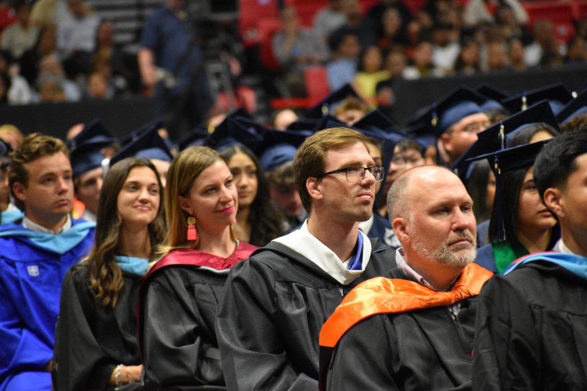 Teachers Elizabeth Mastroianni, Mary Fremeau, Steve Aiello, and Brian Turnbaugh watch the proceedings.