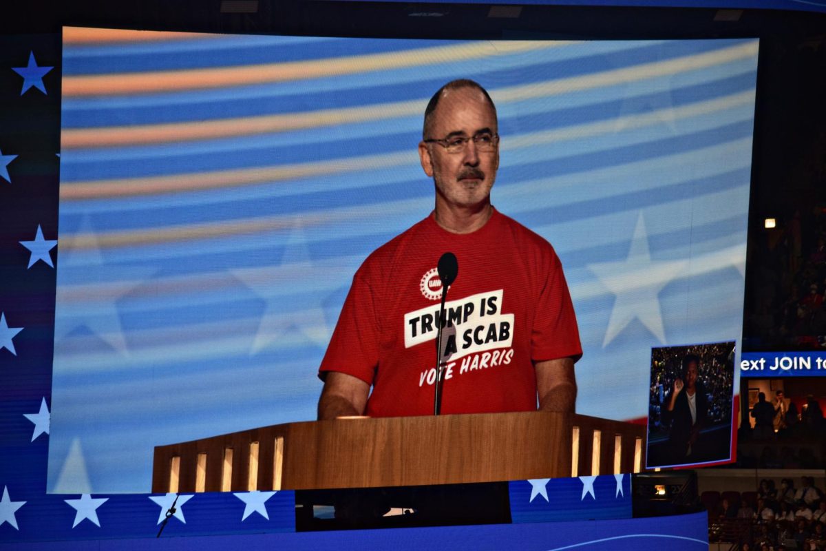 United Auto Workers President Shawn Fain took off his blazer to reveal a now-viral t-shirt that proclaimed "Trump is a scab."