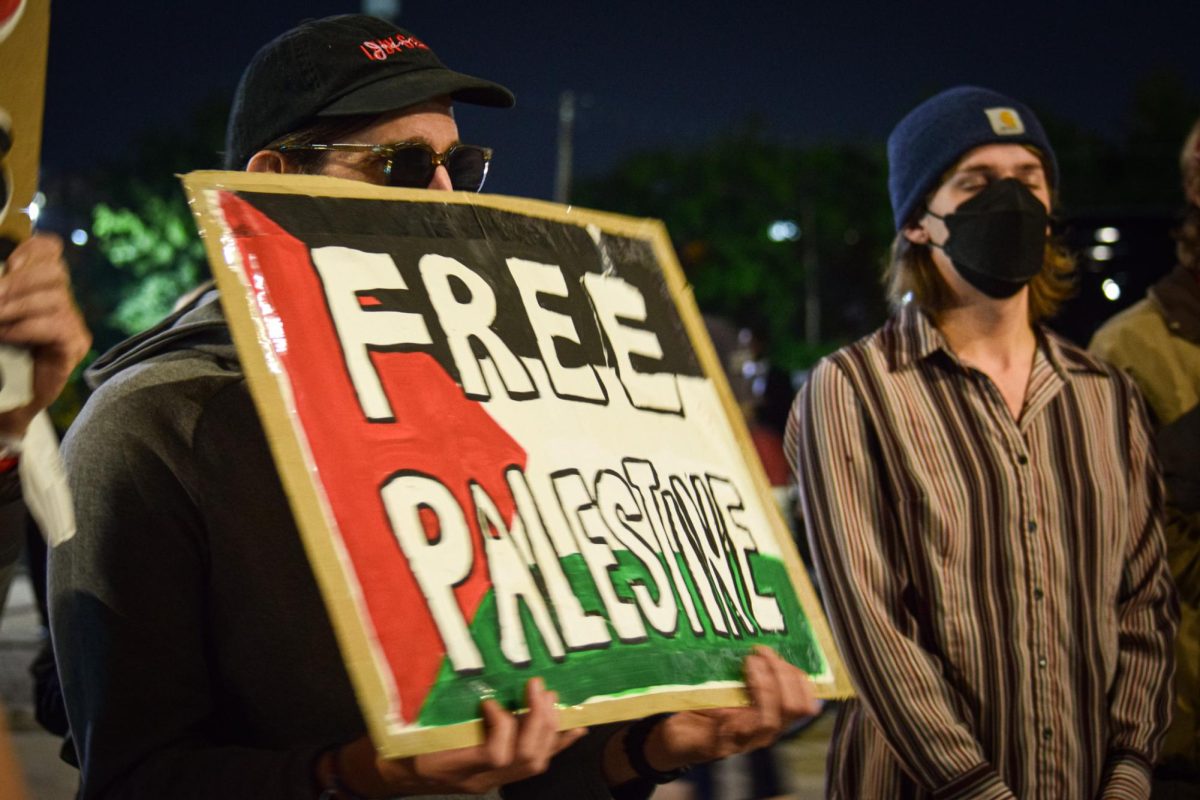 Protestors at near the pedestrian exit from United Center held signs in support of Palestine.