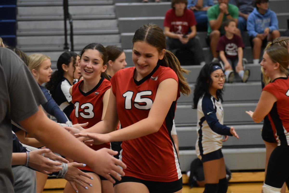 Players end the night by high-fiving their opponents, high school supporters, and teammates. 