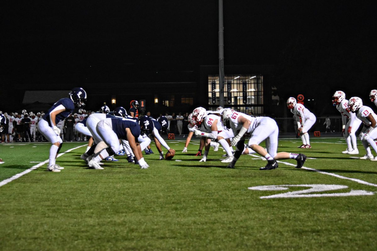 Focused and set, the Wildcats line up before the snap against South Elgin.