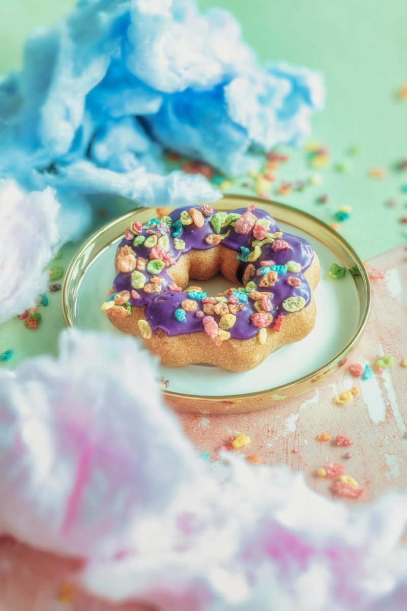 A mochi donut is a hybrid dessert that combines elements of traditional American donuts with mochi, a Japanese rice cake. Mochi donuts are often shaped like rings made up of small, connected dough balls, making them easy to tear apart and share. (Photo courtesy of Deepthi Clicks via Unsplash)