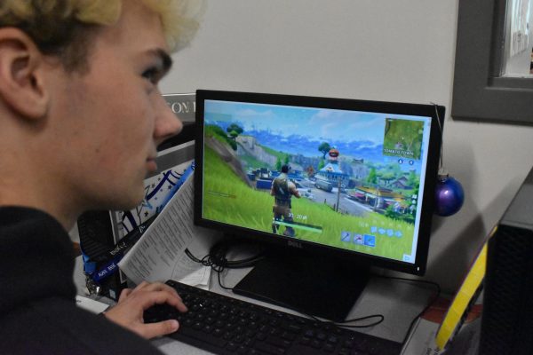 Senior Dylan Kraft hops on "Fortnite" solos, ready to check out the landing spots.