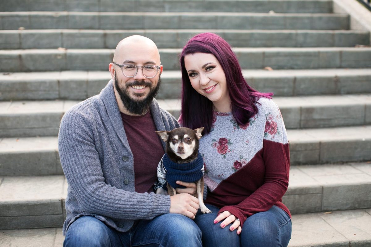 English teacher Healy Rodman and her husband, Adam, cuddle their "elderly rescue Chihuahua," whom Rodman saves she loves "with my whole heart." (Photo courtesy of Healy Rodman)