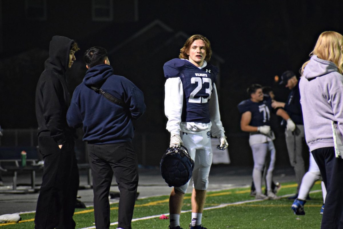 Junior Erik Hoffman takes a breather as the intense Homecoming game persists.