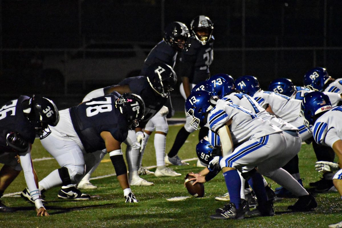 The Wildcats and the Bulldogs get ready for the snap in the first quarter.