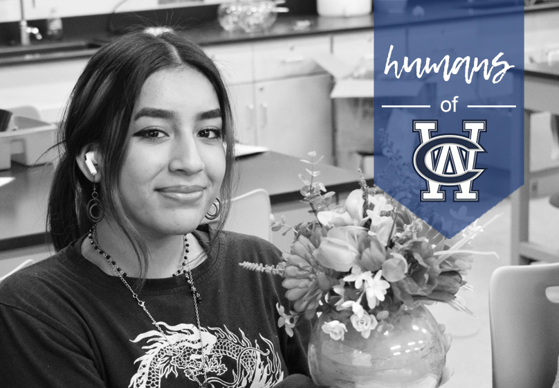 Senior Jesse Fuentes works in horticulture class to craft a bouquet during the spring semester of 2024.