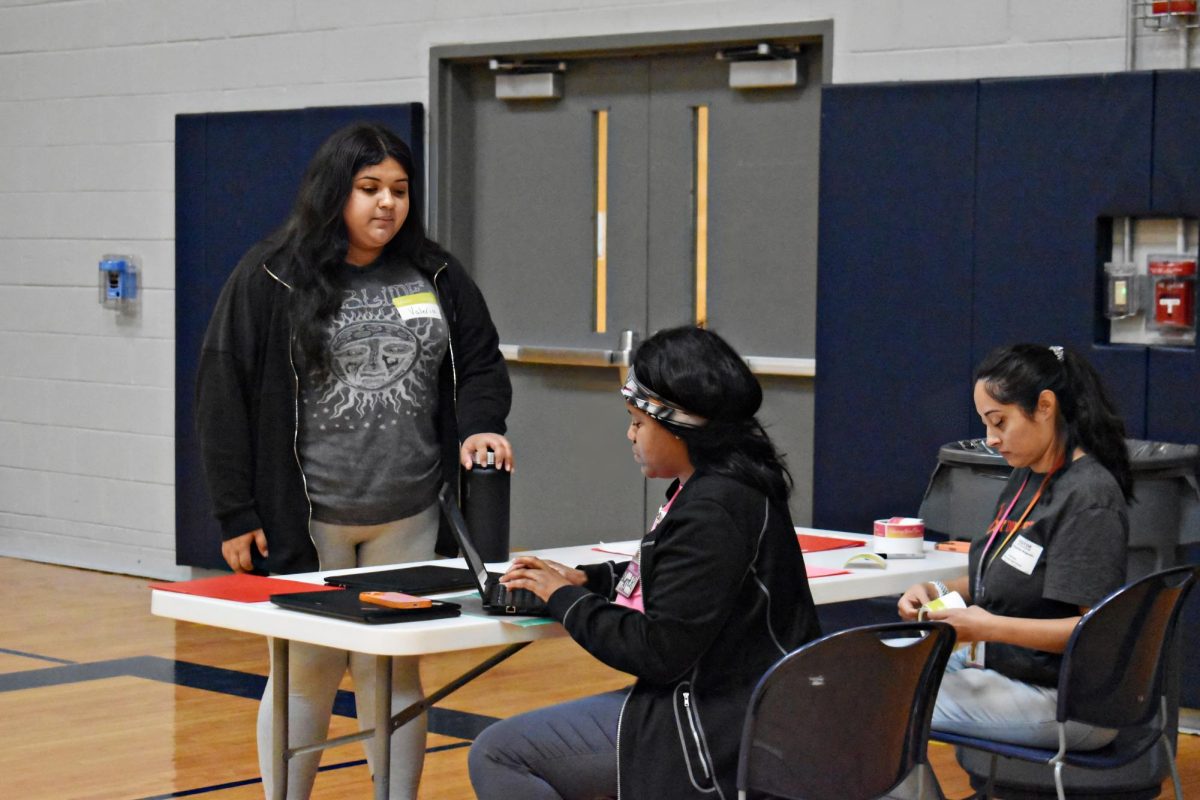 Students who signed up to give blood check-in at the front of the gym. Although the event was coordinated by WCCHS' Interact Club, Versiti Blood Center of Illinois handled registration and all medical aspects of the donation drive. 