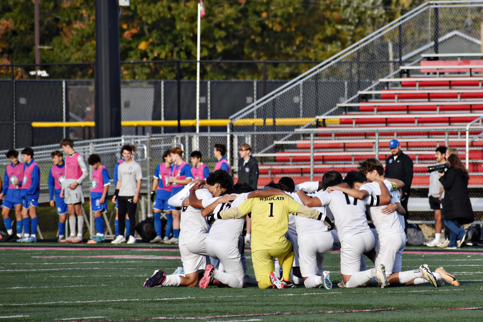 The team gathers before the Oct. 25 regional final to go through their game day ritual.