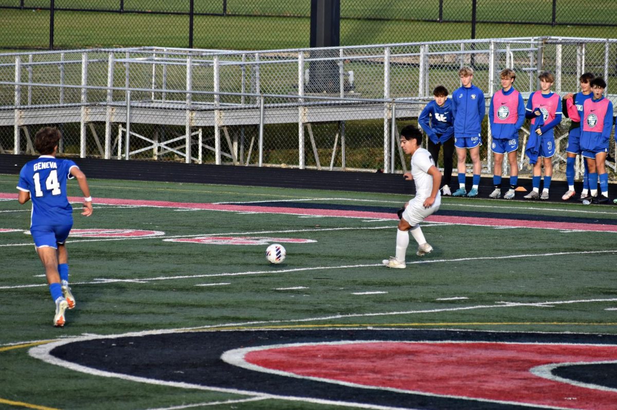 Senior Donovan Avila closes in on the ball as the Vikings attempt to block his kick.