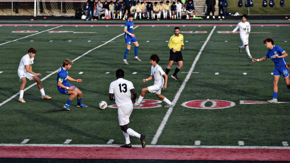 The Wildcats move in on the ball as they attempt to score against the Vikings in the regional final. 