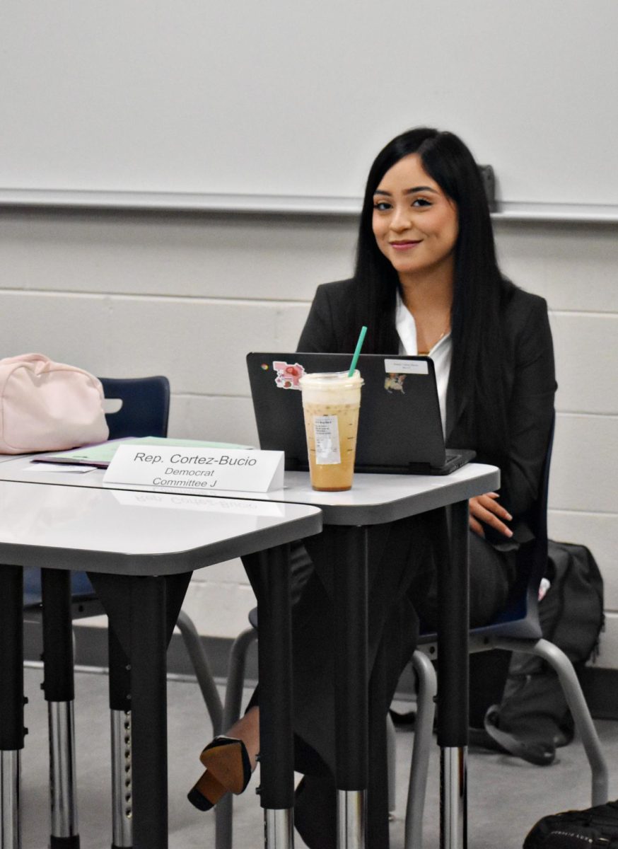 Senior Joana Cortez-Bucio, a Democrat, sits in the study hall room turned committee meeting on Nov. 18.