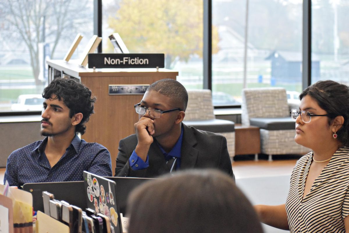 Seniors Raj Singh, Robert Lee, and Stephanie Alfaro listen attentively during the 61st session of the American Government committee meetings on Nov. 18 in the LRC.