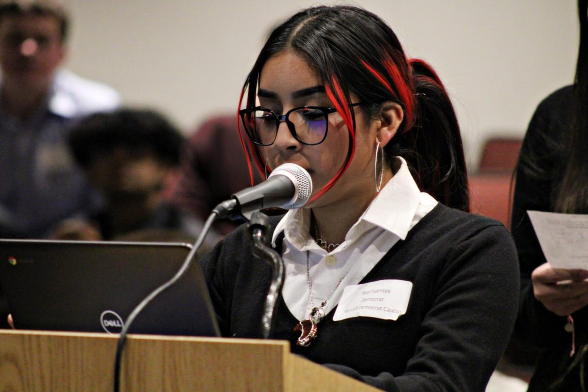 Representative Jesse Fuentes, a senior, shares her opinion during the 61st American Government full simulation.