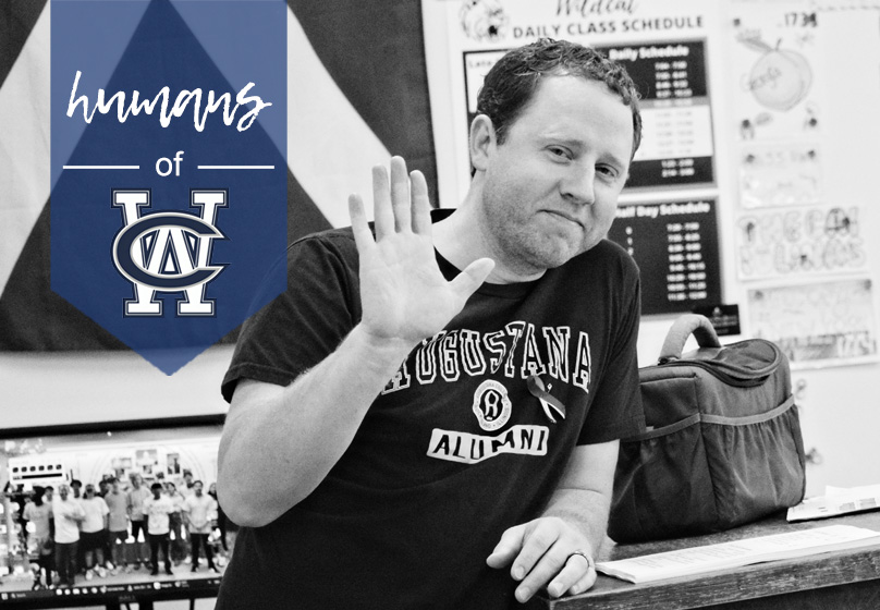 John Chisholm, an Augustana College alumnus, waves to his students during class. His time at Augustana shaped his path to teaching, where he combines his passion for history and mentoring young minds. 