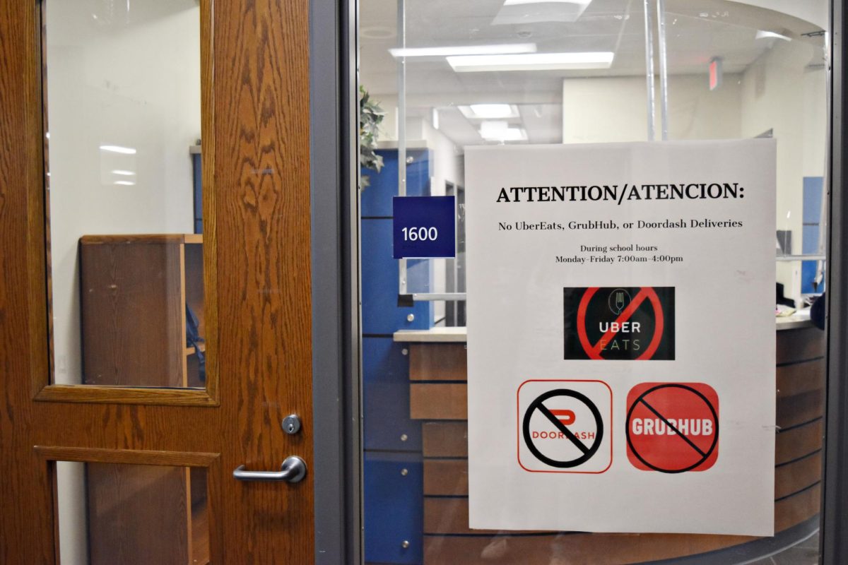 Signs like these can be found around the lunchroom and Door H reminding students that food delivery is no longer welcome from outside carriers. 