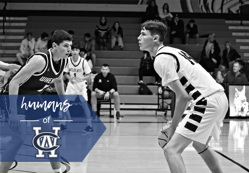 Senior captain Joseph Trigueros surveys the court while facing off against Wheaton during a home game at West Chicago Community High School in Dec. 2024. Trigueros, a three-year Varsity player, has been a key leader for the Wildcats this season.