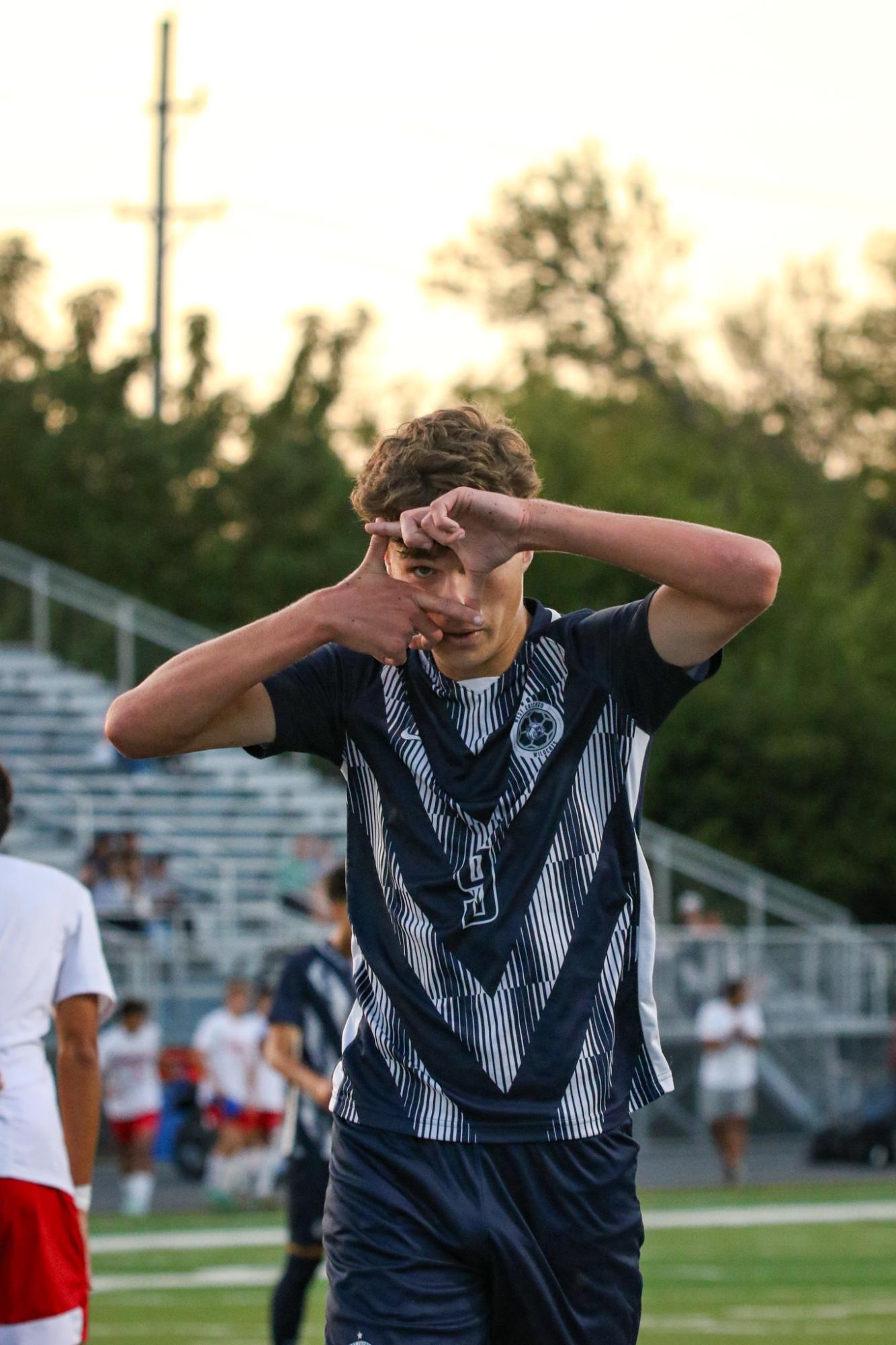 Senior Kuba Slupski celebrating a leading goal with his signature celebration.