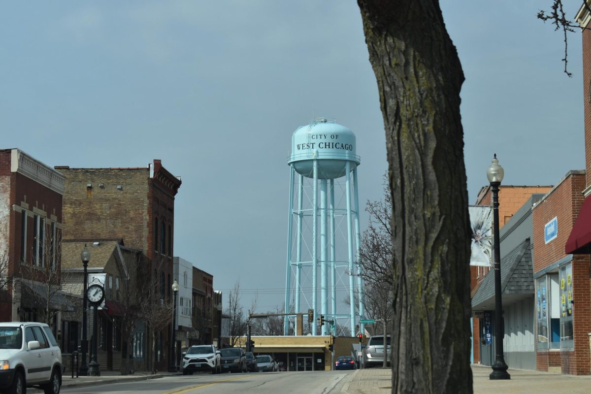 Downtown West Chicago is pictured in the spring of 2025, with the city’s water tower visible above Main Street businesses.
