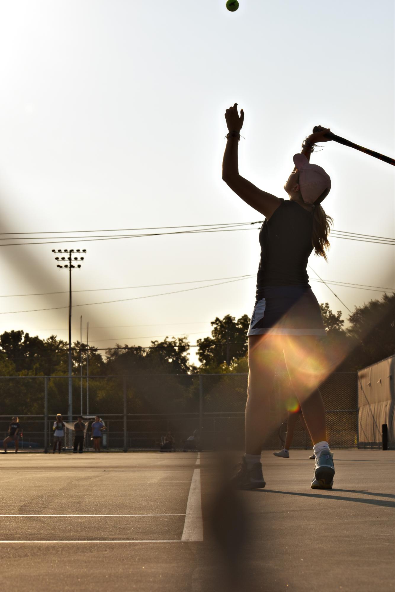 Senior Julia Koput, captain of the girls' Varsity team, serves the ball against Ridgewood High on Sept. 11.