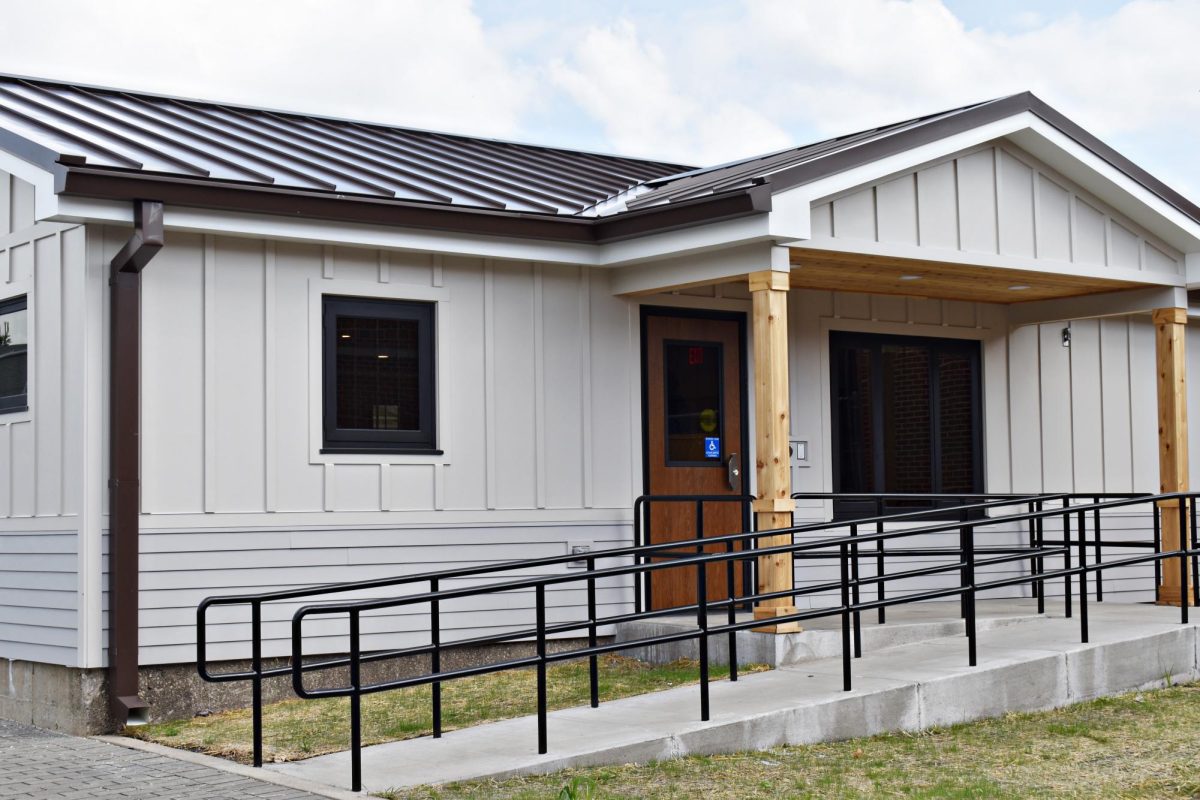 The exterior of the STEP Center at West Chicago Community High School, a single-story brick building constructed on the former greenhouse site, August 2025.