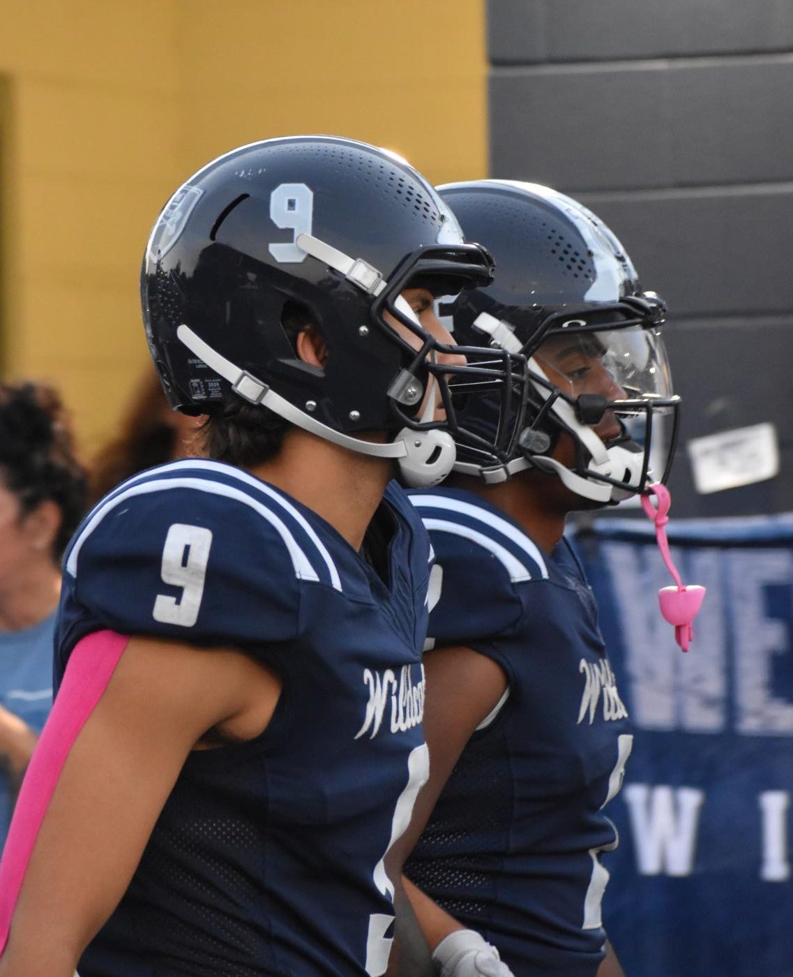 Seniors Roman Zolota and Carter Naranjo walk into the stadium on senior night