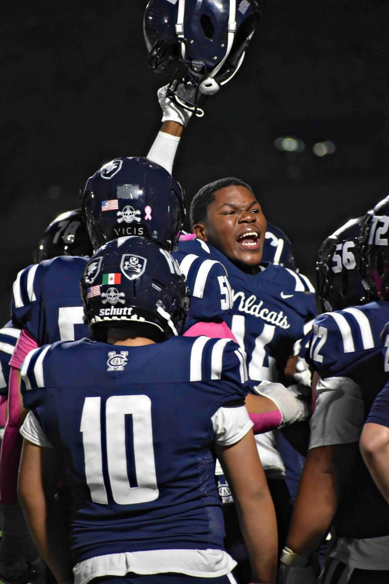The Wildcats regroup at halftime after a rough first two quarters during the home game against Glenbard East on Oct. 10. 