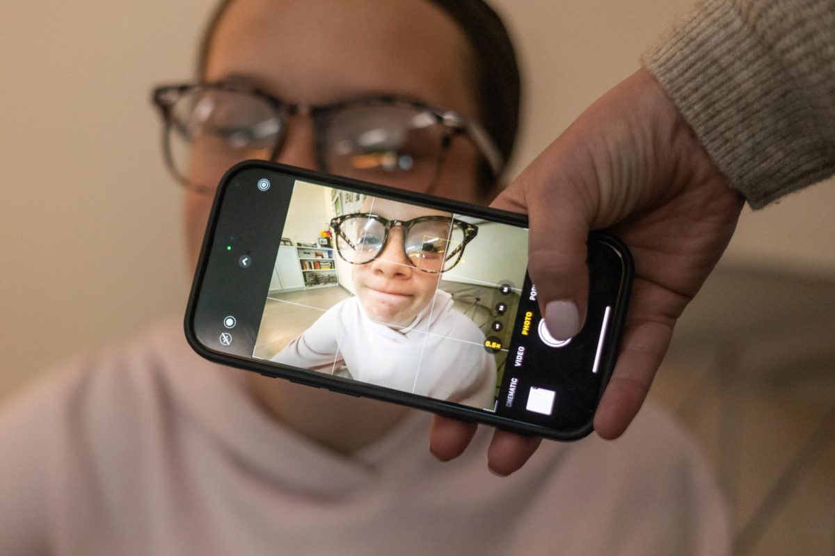 Junior Ana Hurtado gets an awkward wide angle picture of her taken by a classmate.