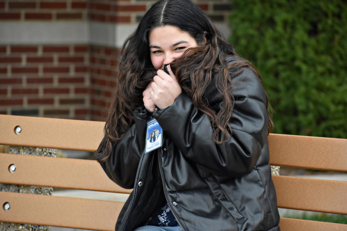 Editor-in-Chief Ja'Nyah Villa bundles up against freezing temperatures outside Entrance 1 on Nov. 24.