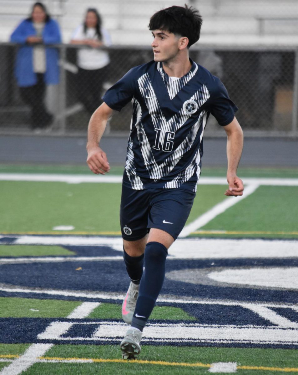 Senior Omar Lutfiyev angles his run, in hopes of a pass