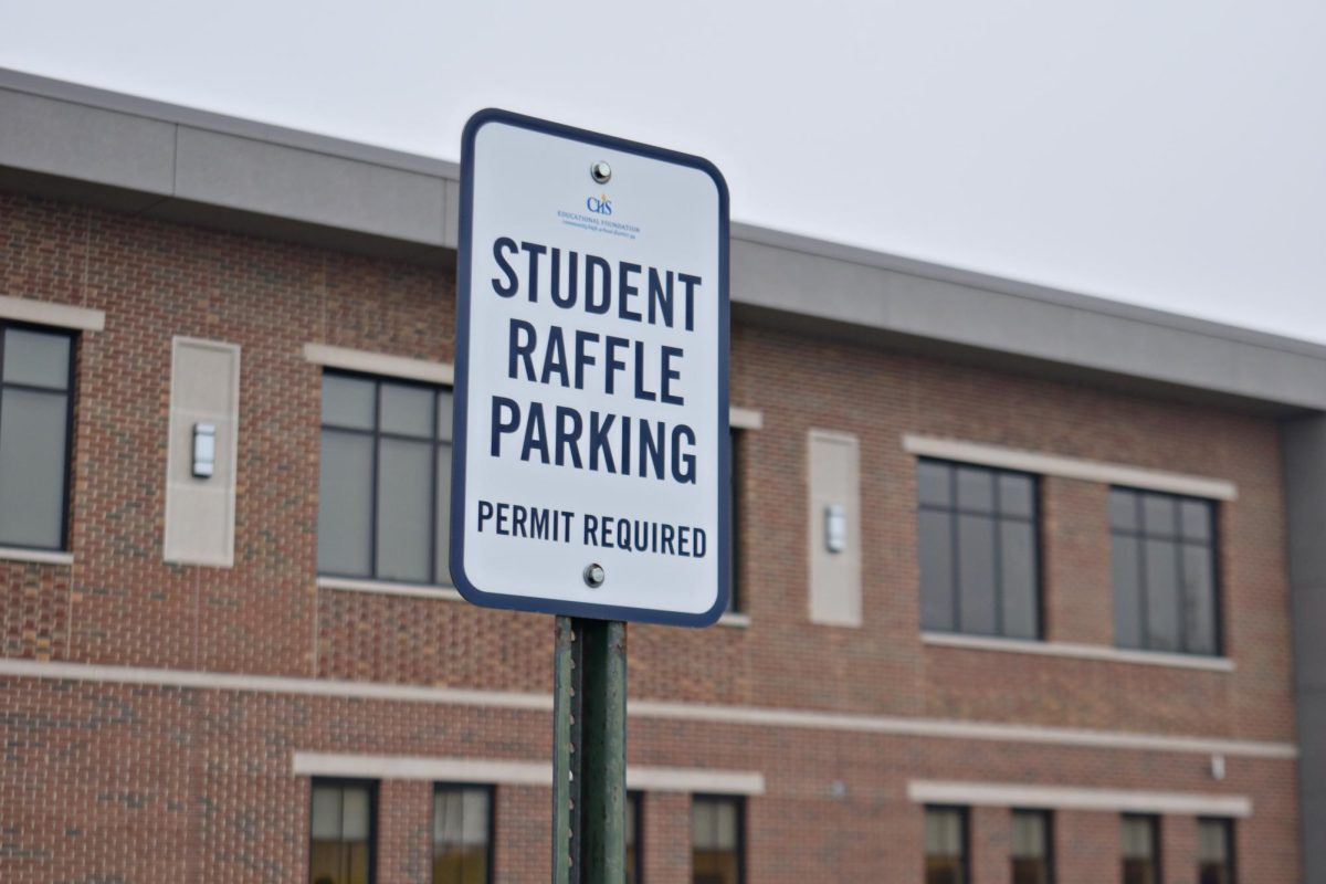 Signs mark the student parking spots at Entrance 1, each of which cost $150 for the year. 