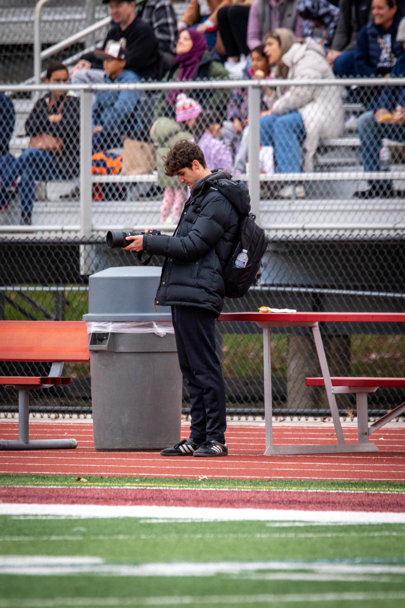 Schaumburg High School senior and photographer Jason Capota captures a playoffs soccer game at home on Nov. 1, 2025.