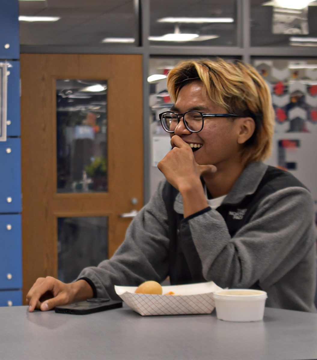 Taking a break from studying, senior Thang Thang shares a laugh with a friend in the Commons on Nov. 7, 2025. The moment reflects how connection and balance play a role in Gen Z’s evolving definition of success.
