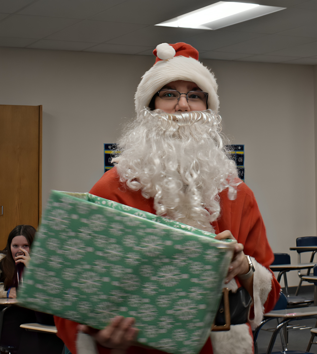 Senior Matthew Krysinski delivers Frosty Grams at West Chicago Community High School on Dec. 11, upholding a long-standing tradition. 