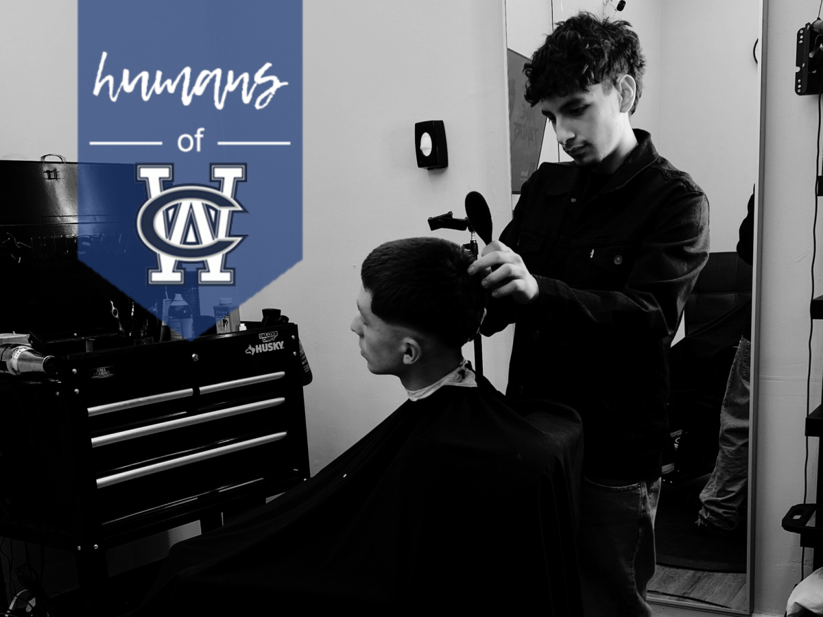 West Chicago Community High School freshman Max Magana focuses as he gives a client a haircut, balancing his passion for barbering alongside his commitment to academics and soccer. The discipline he learns on the field and in the classroom carries over behind the chair, where every cut tells a new story. 