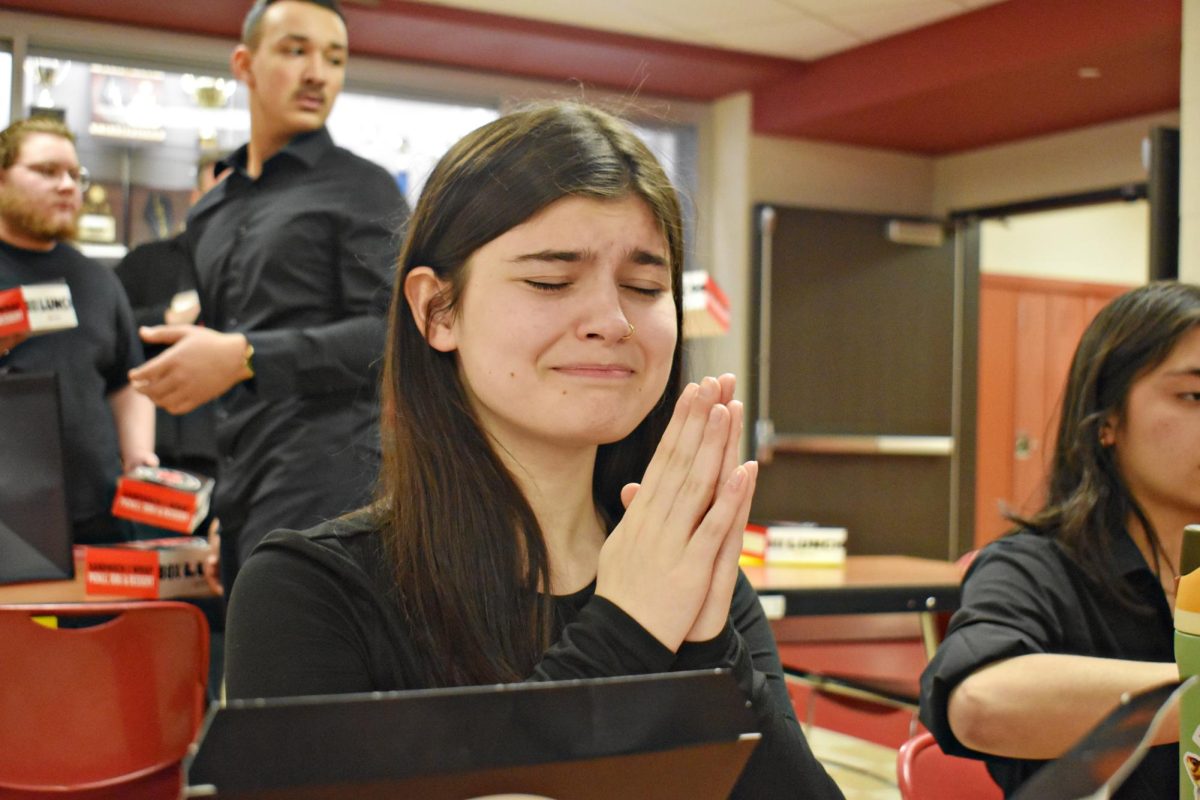Ava Bloniarz, a WeGo Drama member, waits during rehearsal last spring. Students involved in time-intensive activities often juggle long practices, academic work, and other responsibilities, making it difficult to commit to additional clubs. 