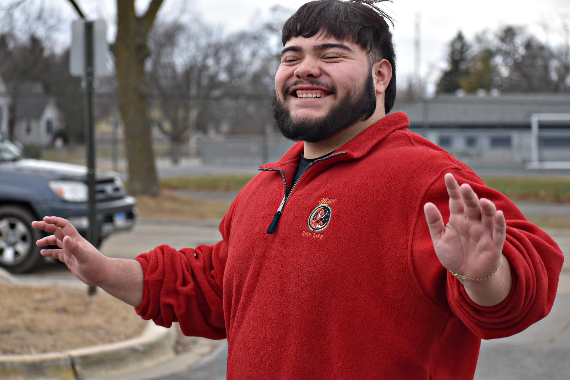 Senior Adrian Alanis reacts to 60-degree weather Feb. 18 in West Chicago. After several days of unusually warm temperatures, rain and snow are expected to return by the weekend.