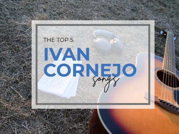 A notepad with handwritten lyrics rests in the grass as guitar chords are practiced nearby on Feb. 25, 2026.