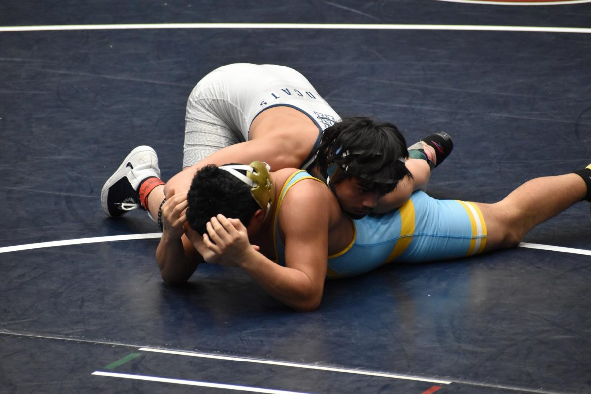 Senior Leo Rosas rides his opponent out to not give him an escape point at the end of the period at Conant High School on Feb. 13.