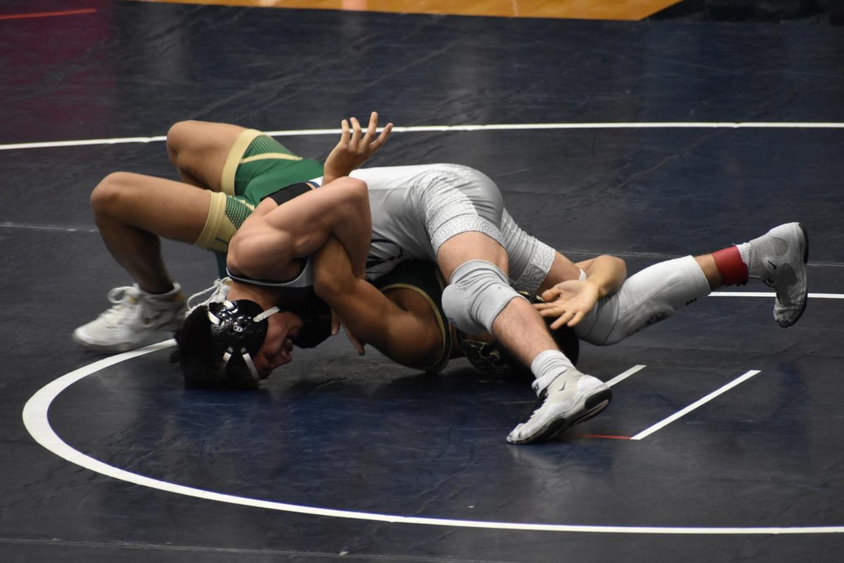 Junior Brian Correa maintains control over his opponent during competition at Conant High School.
