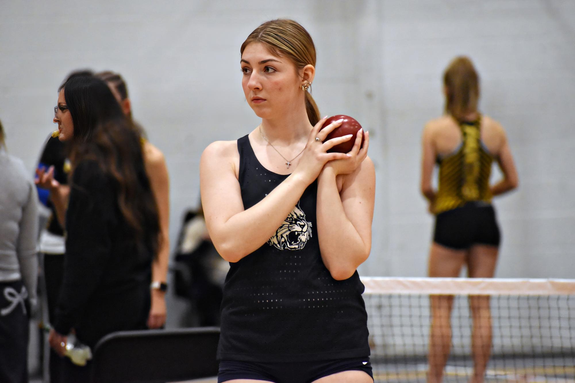 SENIOR SHOT PUTTER: Long-time track and field athlete Julia Bloss, a senior, prepares for her shot put attempt at the meet on Feb. 19 at Glenbard North.
(Image has been upscaled to increase resolution)