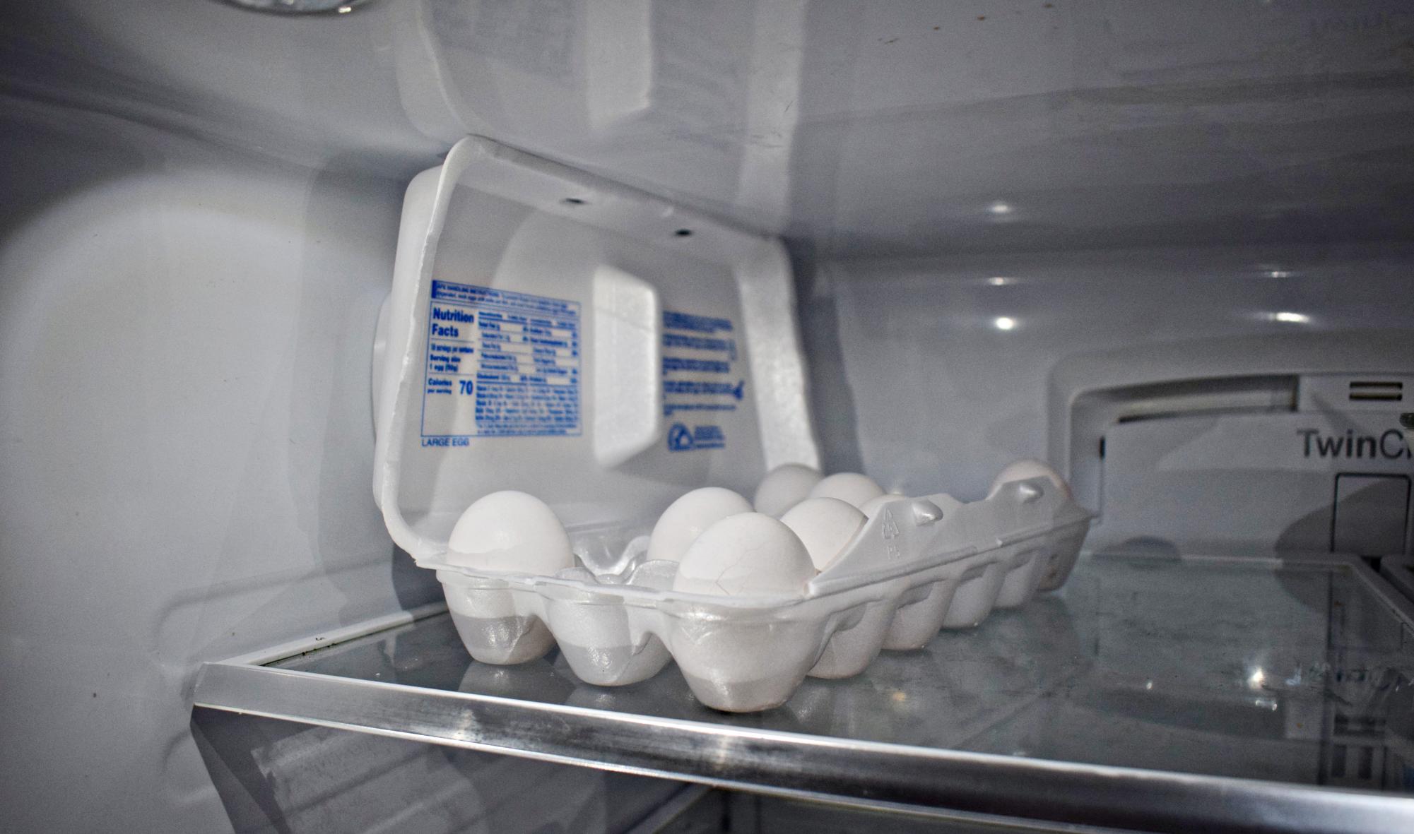 A carton of eggs rests inside a mostly empty refrigerator on Feb. 28, highlighting concerns about rising grocery costs.