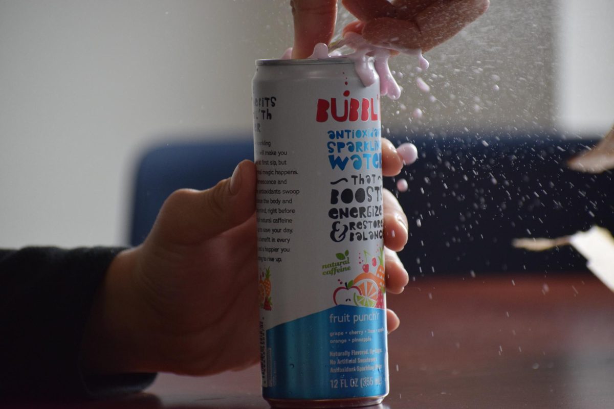  A Bubbl'r being opened and it bursting into the air after being shaken in the English hallway of West Chicago Community High School.