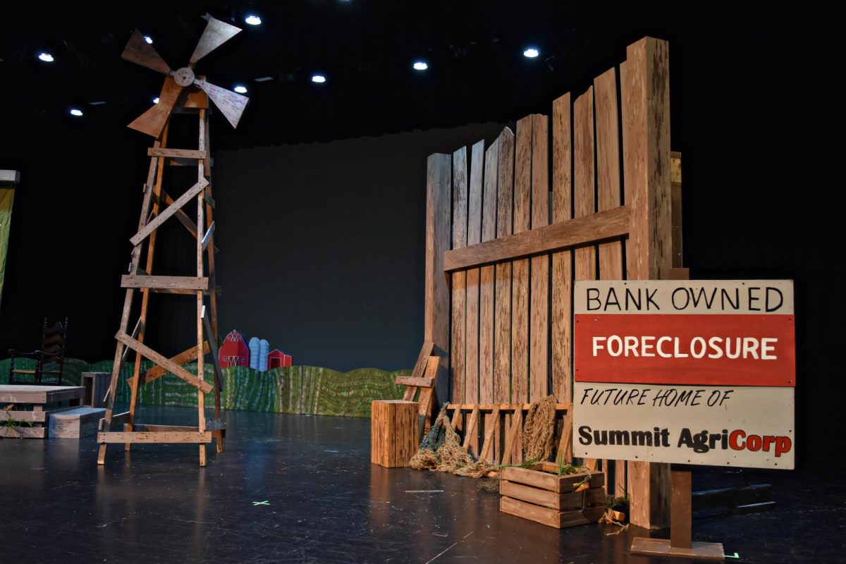 Set pieces, including a windmill and a “foreclosure” sign, are arranged on stage at West Chicago Community High School in preparation for IHSA Drama Sectionals on March 21. Schools will present scenes as part of the statewide competition.