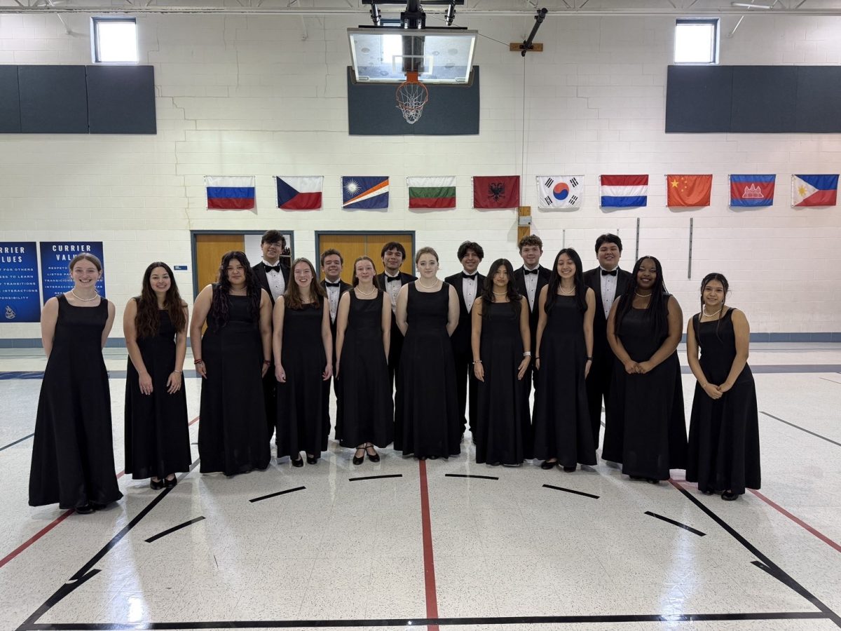 The honors A Cappella Chamber Choir pose for a photo prior to their Currier performance on March 25. (Photo courtesy of Brandon Fantozzi)