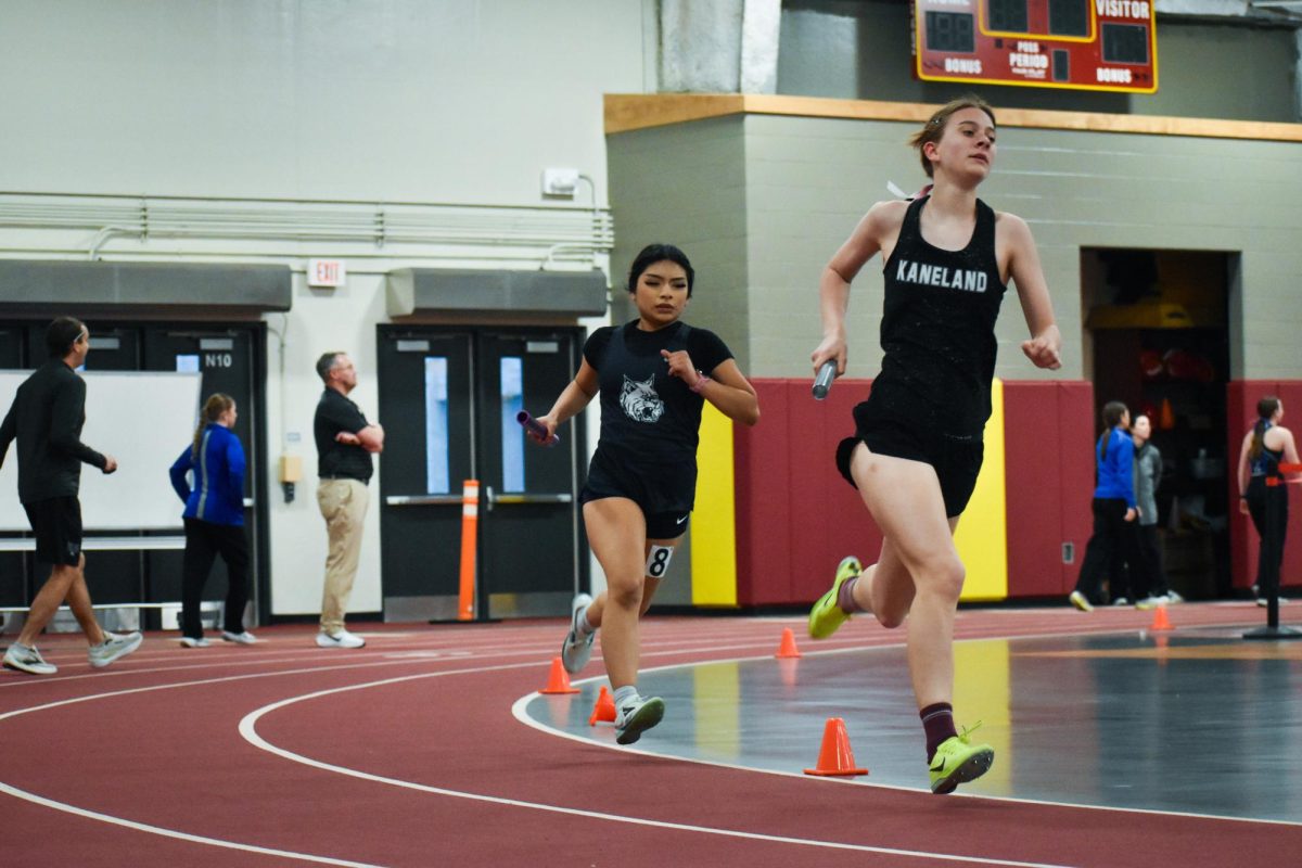 Marisol Hernandez makes her way to pass the next girl in front of her during the four by 800-meter relay; the first event in track and field.